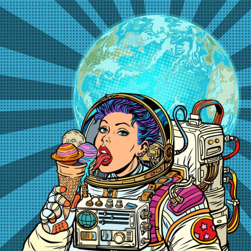 女宇航员吃着由studiostoks , 123RF 设计的行星形状的冰淇淋。